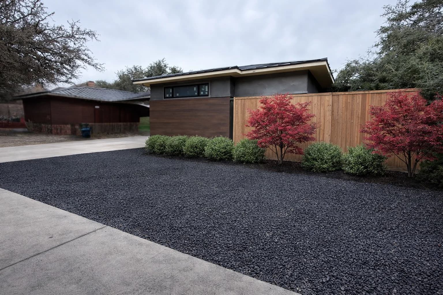 Completed front-yard hardscape refresh with stone walkway and planter walls in Forney.