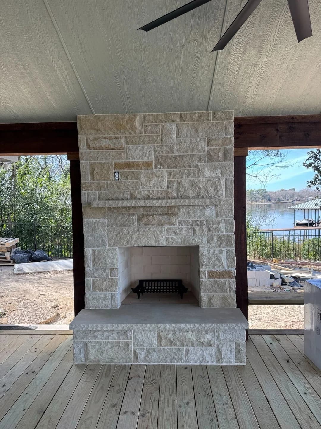 In-progress outdoor kitchen and fireplace build with stone veneer in Heath.