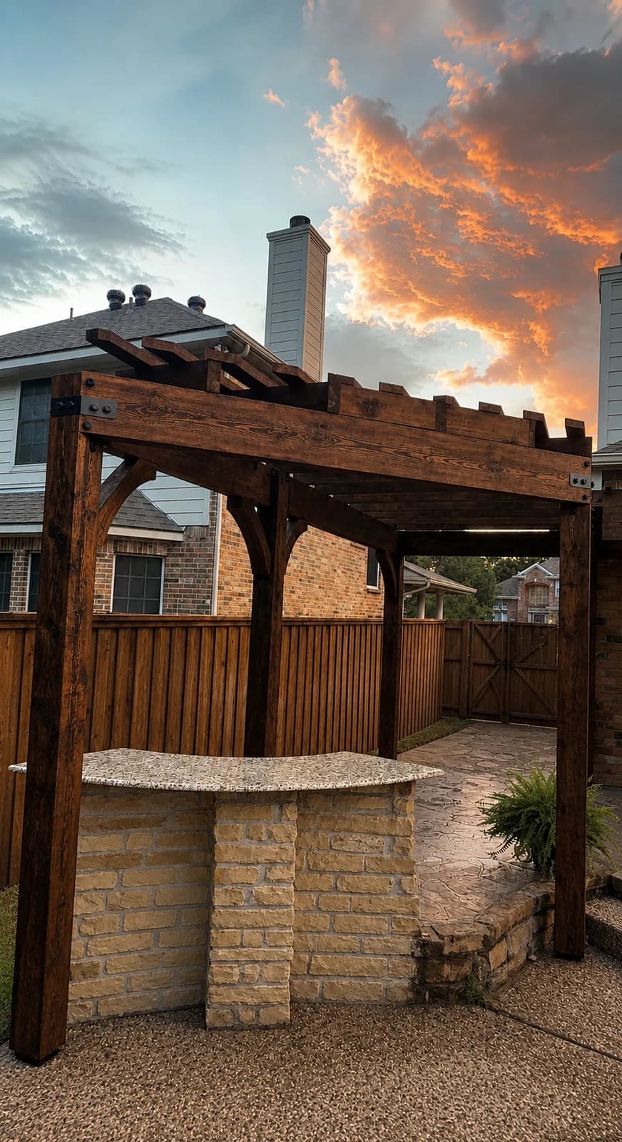 Freestanding cedar pergola over a stone bar