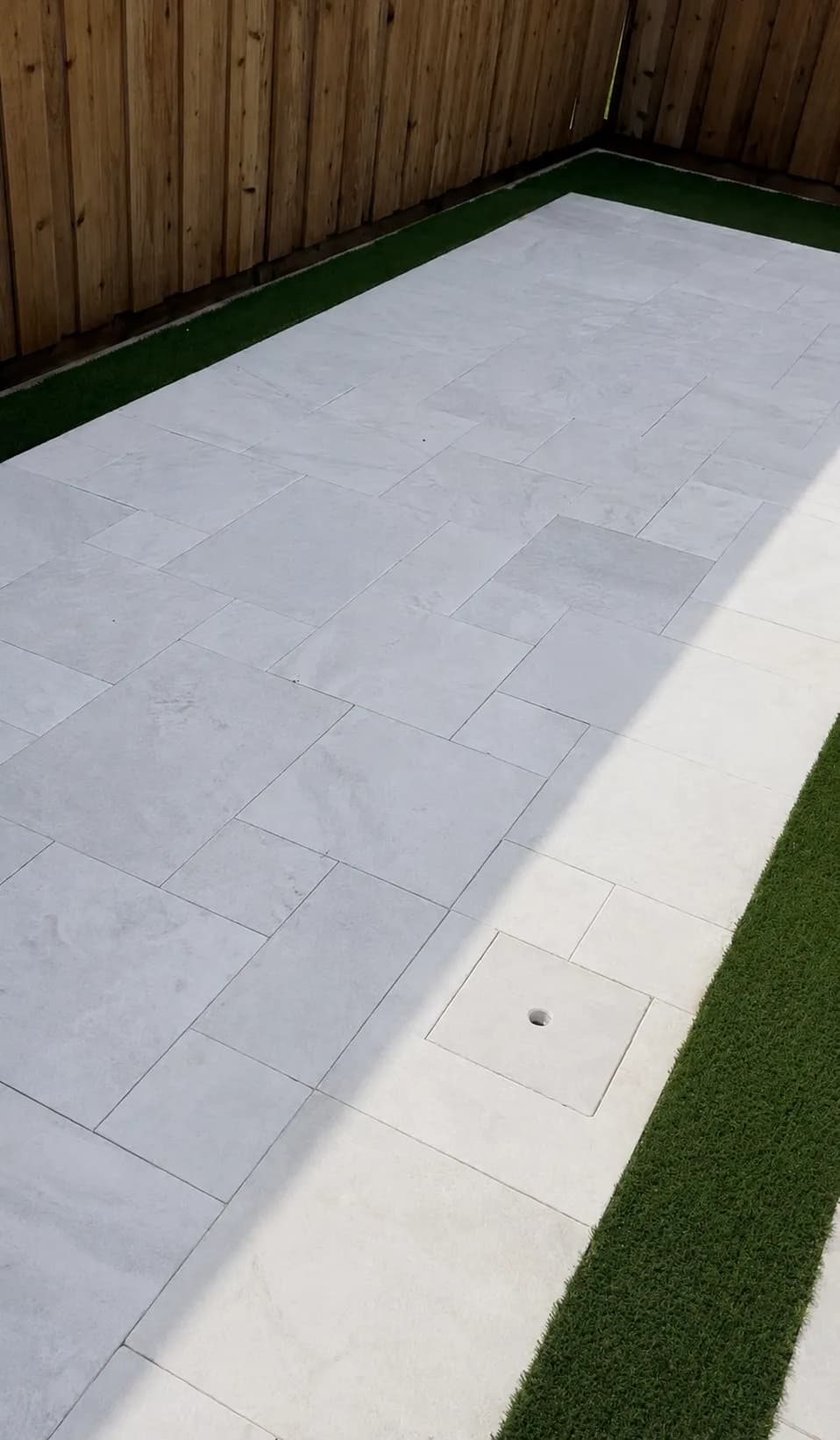 Travertine patio with turf border